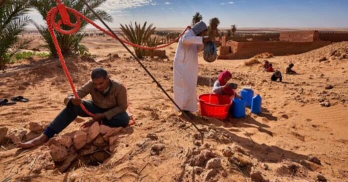Extracting water from a traditional well using a manual pulley system. Credit Abdallah Khalili UNCCD.