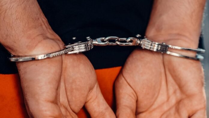 A handcuffed man.
