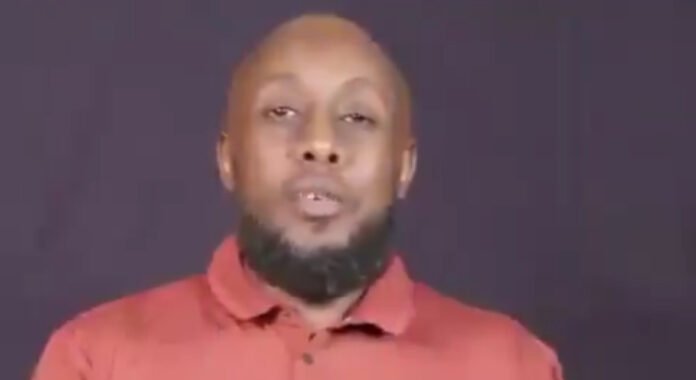Kenyan nurse Ambrose Kimiti appears in an undated video released by Al-Shabaab, appealing to the United Nations and the Kenyan government to help secure his release.
