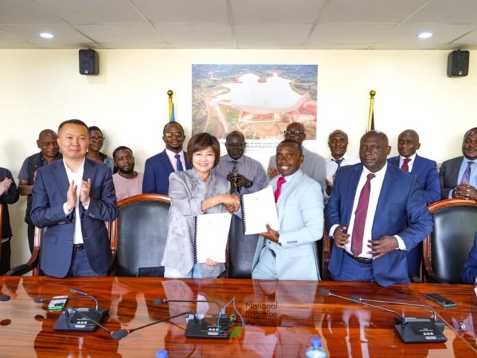National Irrigation Authority CEO Charles Muasya and China Communications Construction Company Kenya Ltd Deputy General Manager Du Shan during the signing of the KSh40 billion Galana Kulalu Dam contract in Nairobi.