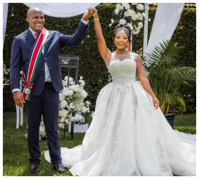 Jomo Gecaga and Lola Newlyweds Jomo Gecaga and Lola Hannigan smile for the cameras on their special day.