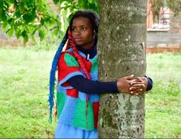 muthoni truphena hugs a tree
