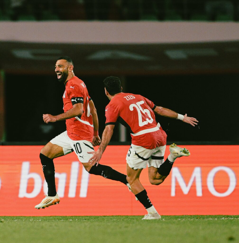 Mohamed Salah celebrates with a teammate after Egypt’s 3‑1 extra-time victory over Benin, securing their place in the AFCON 2025 quarter-finals. Photo: AFCON