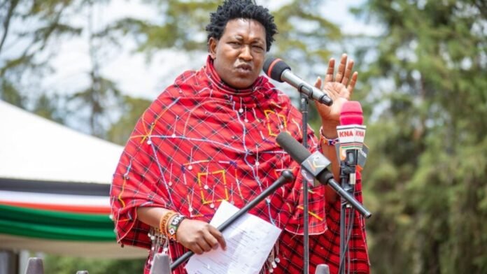 Ledama Ole Kina Narok Senator Ledama Ole Kina addressing attendees during a past public event, highlighting issues of resource allocation and county development.