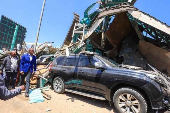 IMG_4985 Kiambu Governor Kimani Wamatangi inspects the damage at his demolished business premises in Nairobi as investigations and political reactions continue.