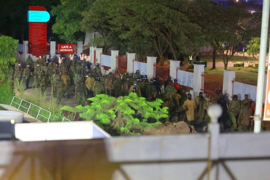 A large contingent of police officers stands guard as demolition works proceed at Governor Kimani Wamatangi’s business premises in Nairobi.