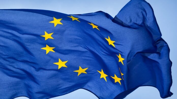 EU Flag The European Union flag flies over the Berlaymont building in Brussels, symbolizing unity and collective action amid rising tensions with the United States over Greenland tariffs.