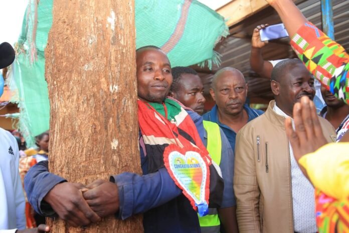 Munene Hugging a Tree
