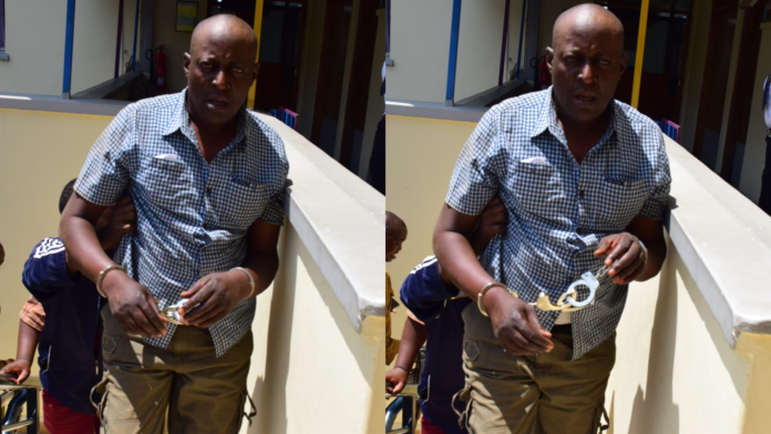 download (4) Sergeant Gilbert Kiama Oduor after he was caught receiving KSh15,000 from a complainant at the Winam Law Courts