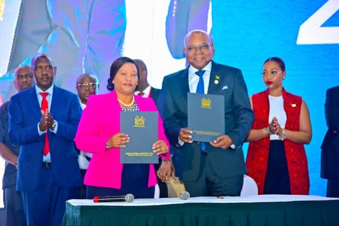 Tourism CS Rebecca Miano and Jamaica’s Tourism Minister Edmund Bartlett at the 4th Global Tourism Resilience Day Conference in Nairobi, discussing AI and innovation to strengthen tourism resilience.