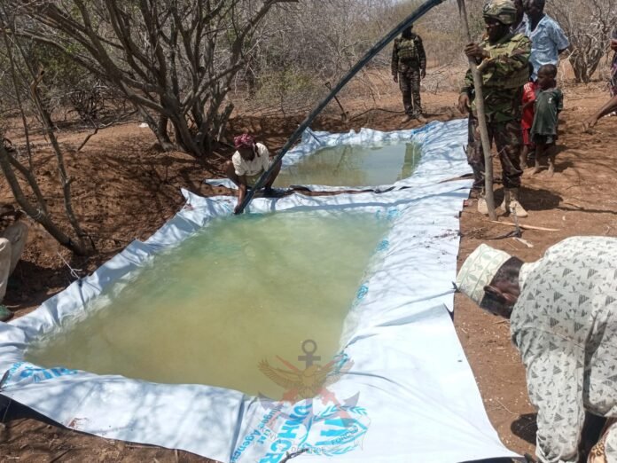 1-13 Kenya Defence Forces troops distributed clean water to residents of Elema Settlement in Wajir as drought worsens in the region.