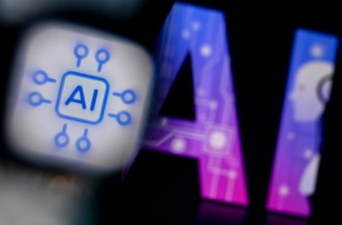 A photo taken on February 26, 2024 shows the logo of the Artificial Intelligence chat application on a smartphone screen (L) and and the letters AI on a laptop screen in Frankfurt am Main, western Germany.
