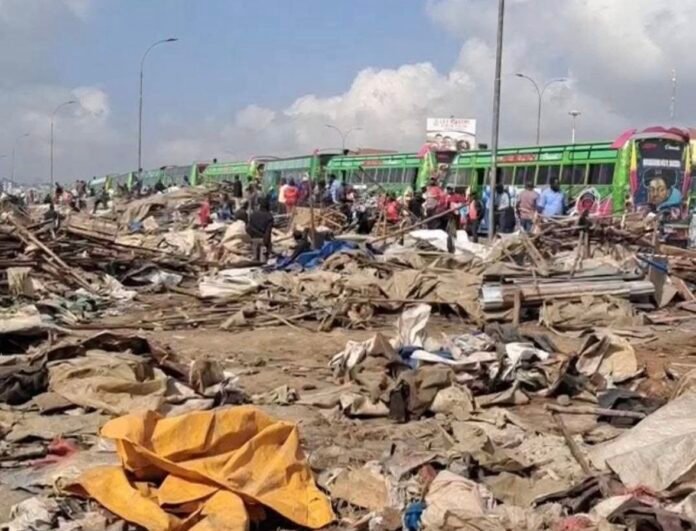 Githurai Demolitions Piles of mangled iron sheets, broken timber and scattered goods lie along the roadside in Githurai 45 after the demolition of informal stalls, leaving traders to sift through debris.