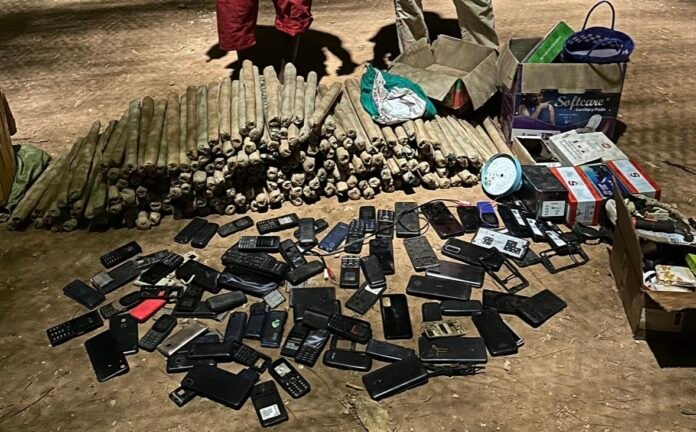 DCI Kenya Police officers display seized cocaine, cannabis, and stolen mobile phones recovered during an intelligence-led operation in Ukunda.