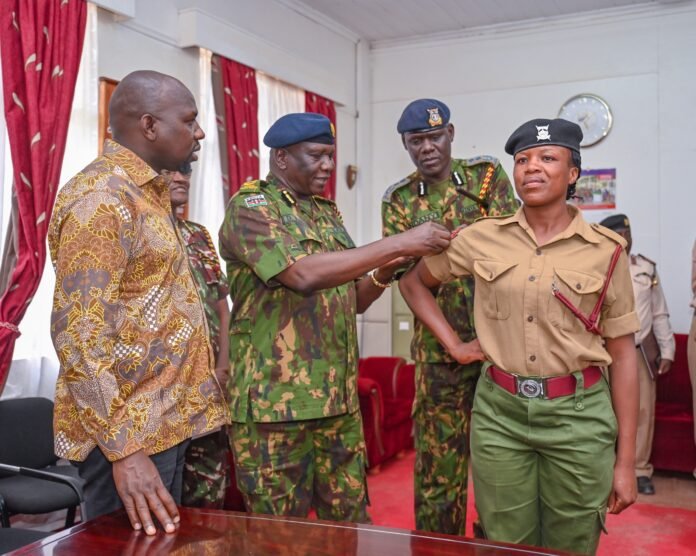 Constable Winfred Gacheri Kinoti Constable Winfred Gacheri Kinoti being promoted by Interior CS Kipchumba Murkomen and IGP Douglas Kanja in Nanyuki, Laikipia County, after 18 years of police service.