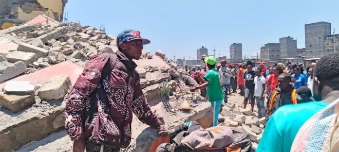Rescue teams including KDF, Kenya Red Cross and police respond after a building collapsed during a demolition exercise in Shauri Moyo, Nairobi.
