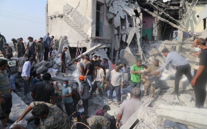 People and rescue forces work following an Israel strike on a school in Minab, Iran, February 28, 2026.