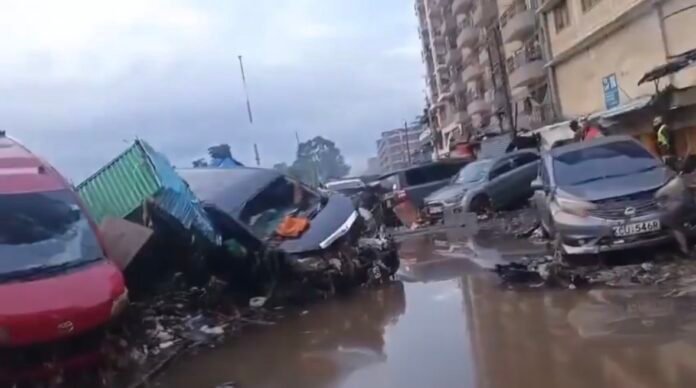 Destroyed vehicles lie piled on top of each other along Kirinyaga Road in the Grogan Area after heavy floods swept through parts of Nairobi, leaving scenes described by residents as war-like.