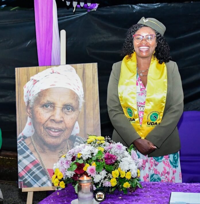Gathoni Wamuchomba Githunguri MP Gathoni Wamuchomba stands beside the portrait of the late Lucia Wangari, mother of Kiambu Senator Karungo Thang’wa, during funeral proceedings.