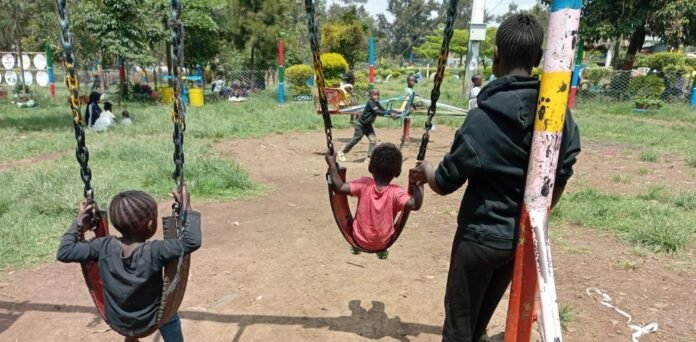 Kamukunji-park-swings Children enjoy playtime at Kamukunji Park, the only green space providing a safe place for children from nearby slums.