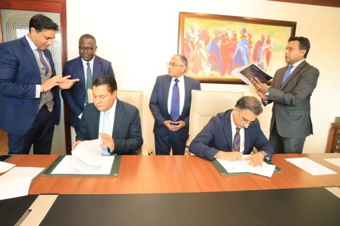 WhatsApp-Image-2026-03-10-at-21.32.38 Taifa Group Founder, Rostam Azizi, and Sultan Ali Allana, Director of the Aga Khan Fund for Economic Development (AKFED), sign transaction documents at Serena Hotel, Nairobi, on March 10, 2026. Following the signing, Taifa Group—through its affiliate Taarifa Ltd—acquired the entire shareholding previously held by AKFED in NPRT Holdings Africa Limited (NPRT), a Kenyan private limited liability company that holds the majority stake in Nation Media Group