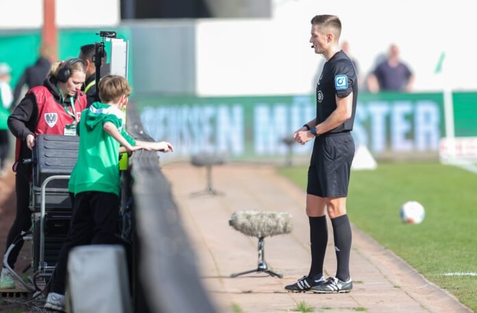 A masked fan unplugged a VAR monitor during a Bundesliga 2 match between Preussen Münster and Hertha Berlin, forcing officials to rely on the central VAR decision.