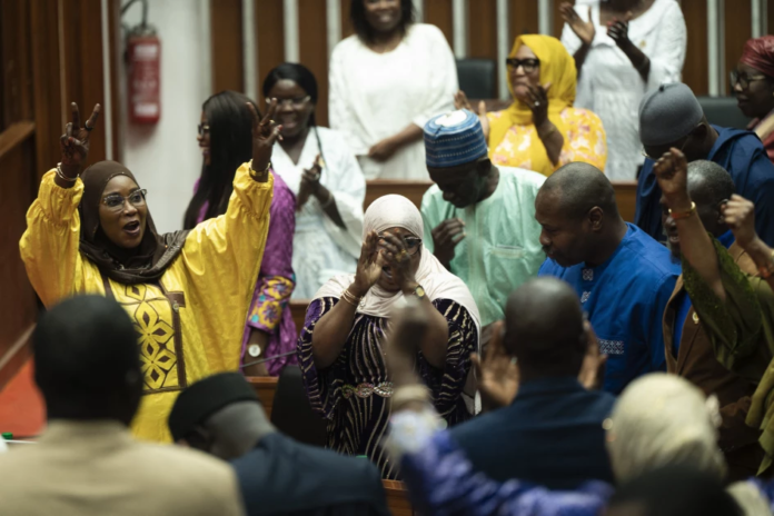 senegal same sex penalty Majority deputies celebrate after the adoption of a law doubling the penalties for homosexuality at the National Assembly in Dakar on March 11, 2026.