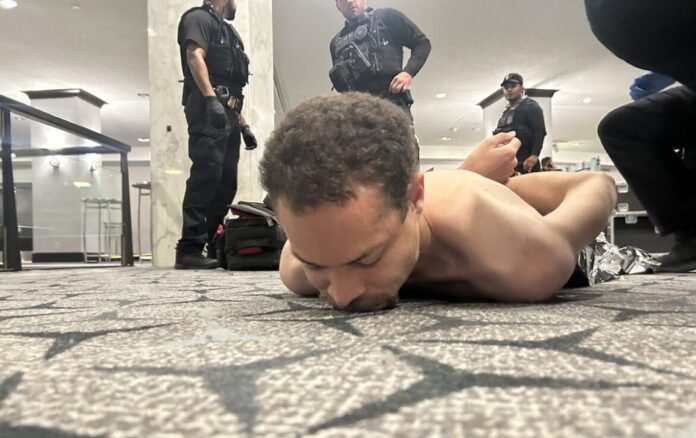 Law enforcement officers secure the scene after an armed suspect was arrested following an attempted breach of a security checkpoint in Washington, D.C.. The suspect was taken into custody after an exchange of gunfire with the United States Secret Service.