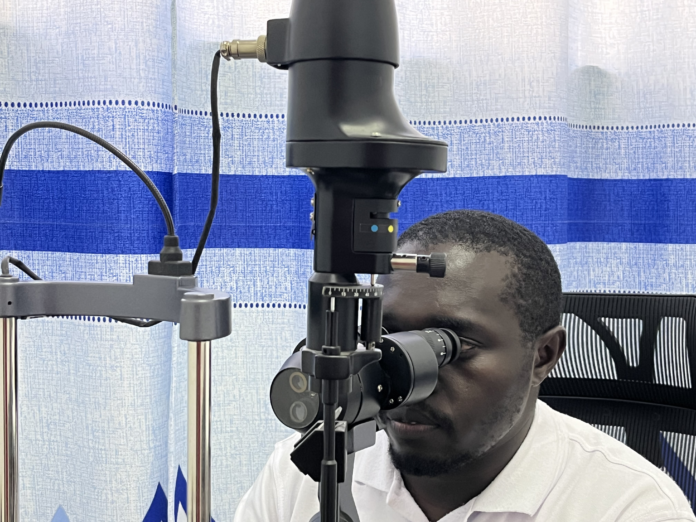 image Ophthalmologist Amos Kiptoo using a specialist equipment for eye treatment at Siloam Eye Center in Eldoret