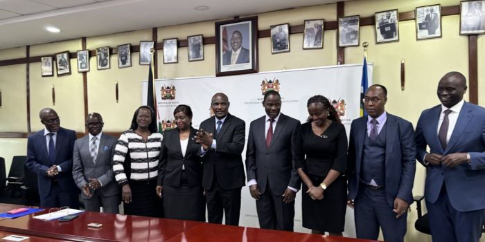 Treasury CS John Mbadi (centre and clapping) poses for a photo with officials from the Privatisation Authority after receiving over Ksh 103 billion cheque proceeds of KPC sale on April 23, 2026 