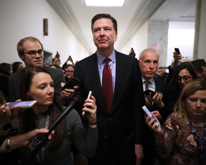 image Former FBI Director James Comey has been charged over alleged threats against President Trump linked to a social media post featuring coded numbers.