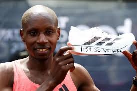 Sebastian Sawe holds the Adidas Adizero Adios Pro Evo 3 shoes he ran the London Marathon in