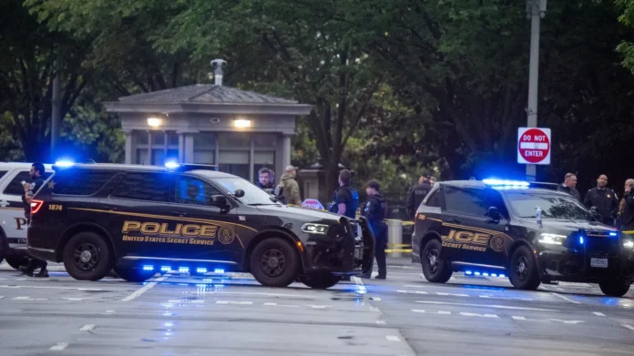 Secret Service officers secure the area near the White House following a deadly shooting involving an armed suspect in Washington, D.C.