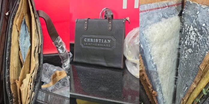 Security officers inspect seized methamphetamine concealed in handbags at JKIA.
