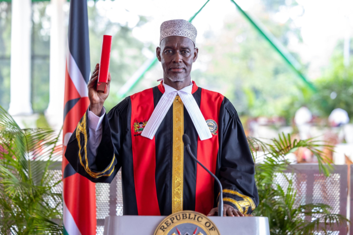President Ruto congratulates Justice Mohamed Warsame after his swearing-in as Supreme Court judge at State House Nairobi.