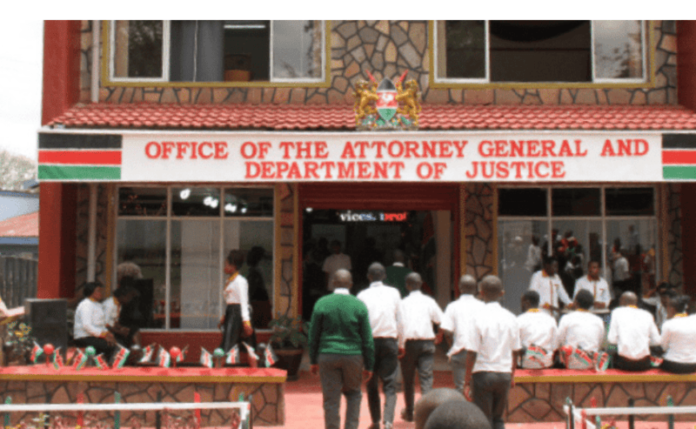 Exterior view of Sheria House, the Nairobi headquarters of Kenya's Office of the Attorney General and Department of Justice, featuring the national flag.