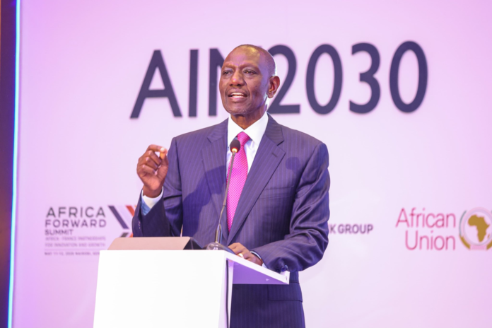 A photograph of President William Ruto at a high-level summit in Nairobi. He is addressing an audience of delegates, gesturing while advocating for the strengthening of the African Continental Free Trade Area (AfCFTA) and the African Medicines Agency (AMA) to reduce the continent's 90pc reliance on imported medicines.