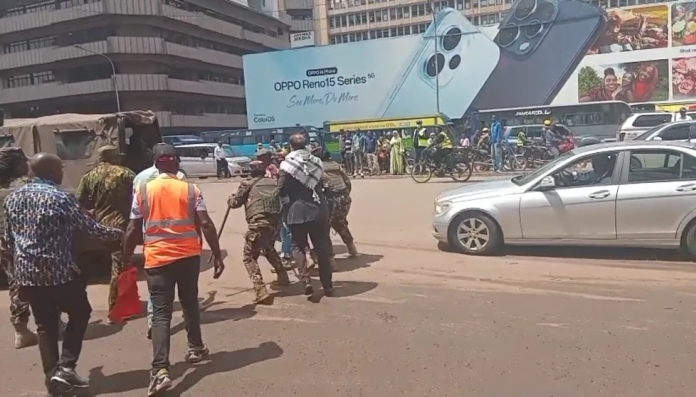 Anti-riot police in Nairobi blocking a group of human rights activists from accessing the Kenyatta International Convention Centre (KICC) during the Africa Forward Summit