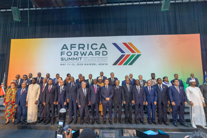 President William Ruto of Kenya and President Emmanuel Macron of France standing alongside UN Secretary-General António Guterres and over 20 African heads of state for a group photo at the Africa Forward Summit in Nairobi.