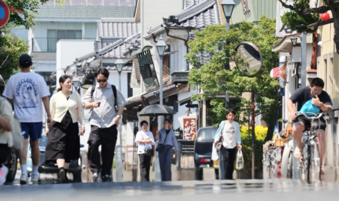 Japan’s economy grew faster than expected in early 2026, but rising inflation and Middle East tensions are increasing pressure on households and policymakers.