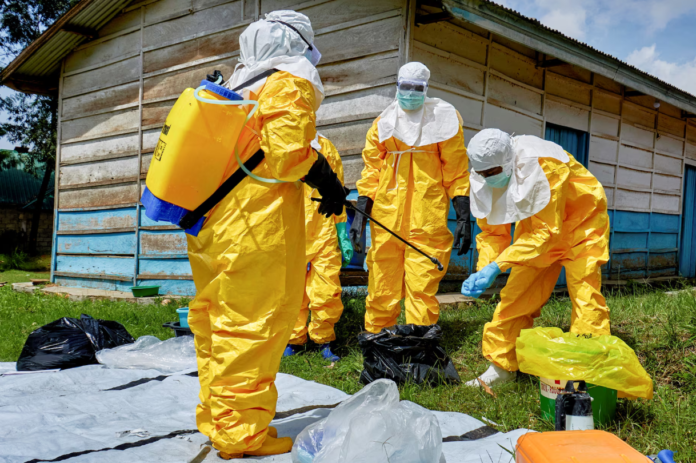Medical workers in protective equipment responding to Ebola outbreak . Photo/Courtesy